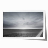Vibrant rolled print showcasing a stunning landscape with dramatic skies, featuring rich colors and intricate details, perfect for home decor.