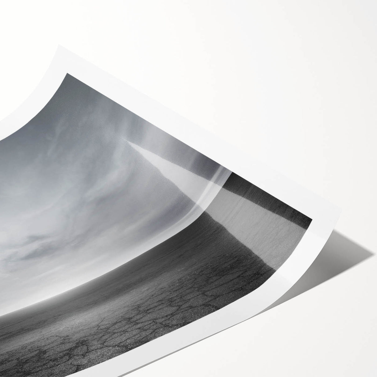 Stunning rolled print of a vibrant landscape featuring a sunset sky with dramatic clouds, ideal for home decor or art collection, securely packaged in a protective tube.