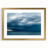Gold-framed wall art collection showcasing vibrant landscapes and skyscapes, elegantly matted, perfect for enhancing modern decor with a touch of nature.