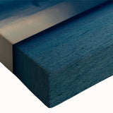 Close-up of a stretched canvas showcasing vibrant landscapes and skyscapes in a modern art design, perfect for home decor, adding a pop of color to any room.