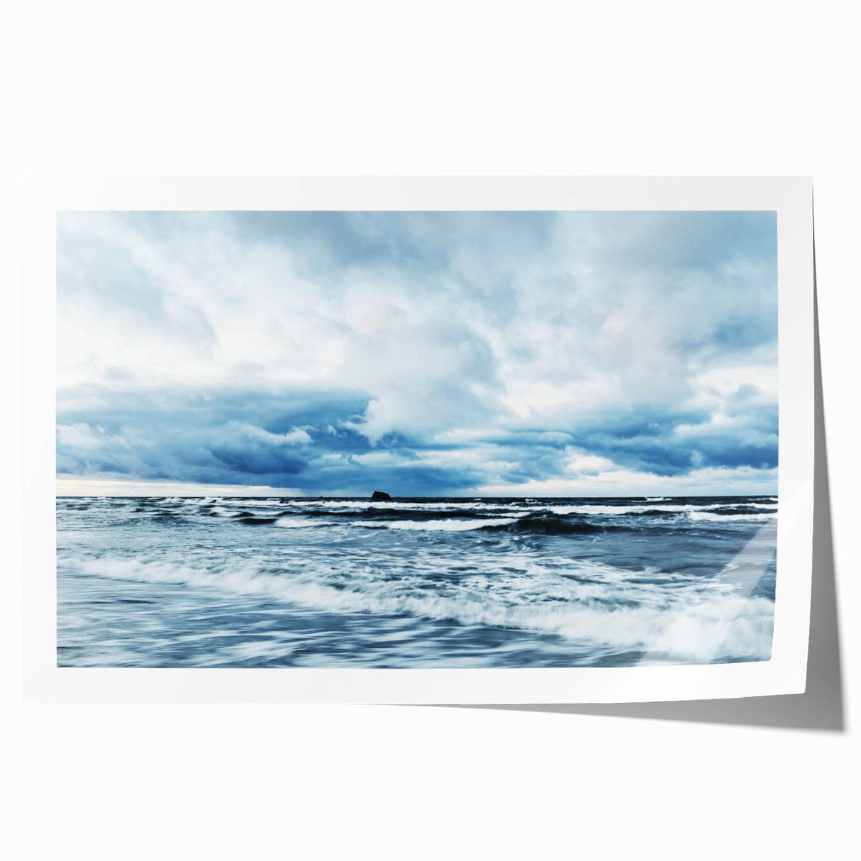 Rolled print showcasing a serene landscape with vibrant hues of blue and orange, ideal for home decor; packaged in a protective cardboard tube for safe shipping.