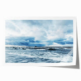 Rolled print showcasing a serene landscape with vibrant hues of blue and orange, ideal for home decor; packaged in a protective cardboard tube for safe shipping.