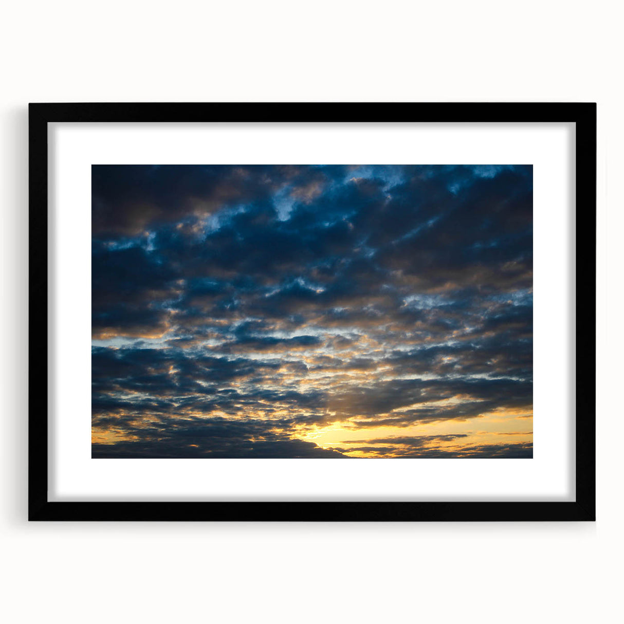Framed wall art featuring a modern landscape design in vibrant colors, presented in a sleek black frame with a white mat, perfect for contemporary decor.