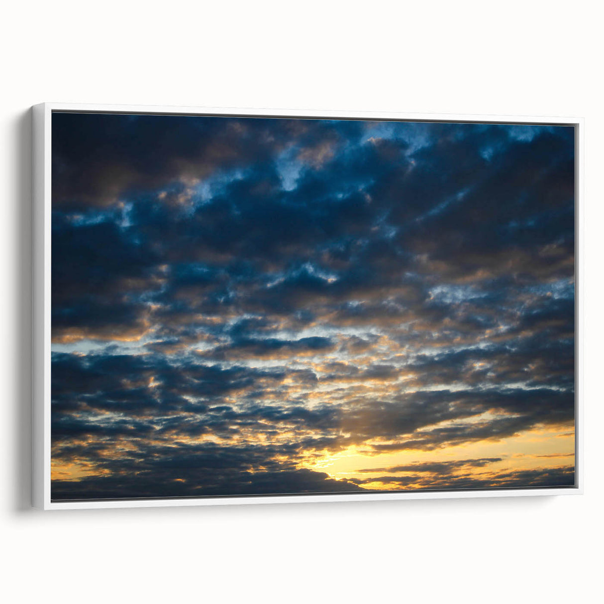 Framed canvas wall art showcasing a serene landscape with vibrant colors and intricate details, positioned against a white background for a contemporary look.