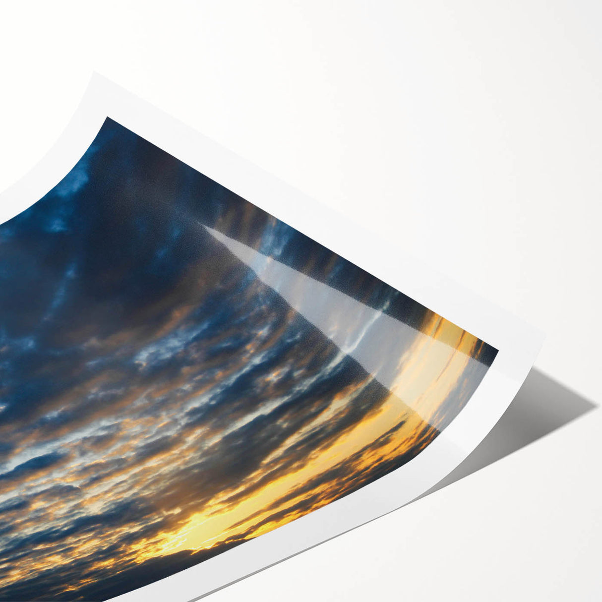 Vibrant rolled print of a serene landscape with a dramatic sky, showcasing rich colors and fine details, ideal for home decor in contemporary settings.