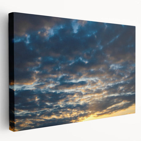 Stretched canvas artwork showcasing a vibrant landscape with a vivid sunset, displayed in a side view to highlight its depth and texture, perfect for home decor.