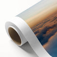 Rolled canvas showcasing a vibrant landscape and skyscape design, featuring rich colors and intricate details, ideal for home decor and artistic displays.