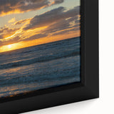 Close-up of a framed canvas wall art piece showcasing a serene landscape with vibrant colors, featuring rolling hills and a dramatic sky, perfect for home decor.