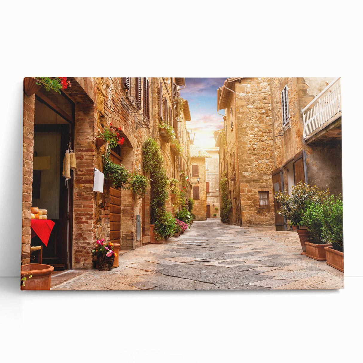 Stretched canvas wall art design showcasing a vibrant landscape scene with colorful streets and buildings, perfect for modern home decor. The artwork leans against a neutral wall, highlighting its rich colors and intricate details that enhance any space.