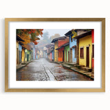 Framed wall art featuring a vibrant landscape street design, elegantly displayed with a gold mat, perfect for enhancing modern home decor aesthetics.