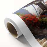 Rolled canvas wall art showcasing a vibrant city street landscape with bold colors and intricate designs, ideal for modern home decor. Packaged securely in a cardboard tube for safe delivery.