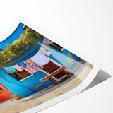 Rolled print of a vibrant urban landscape design featuring colorful streets and buildings, ideal for modern home decor, packaged securely in a cardboard tube.