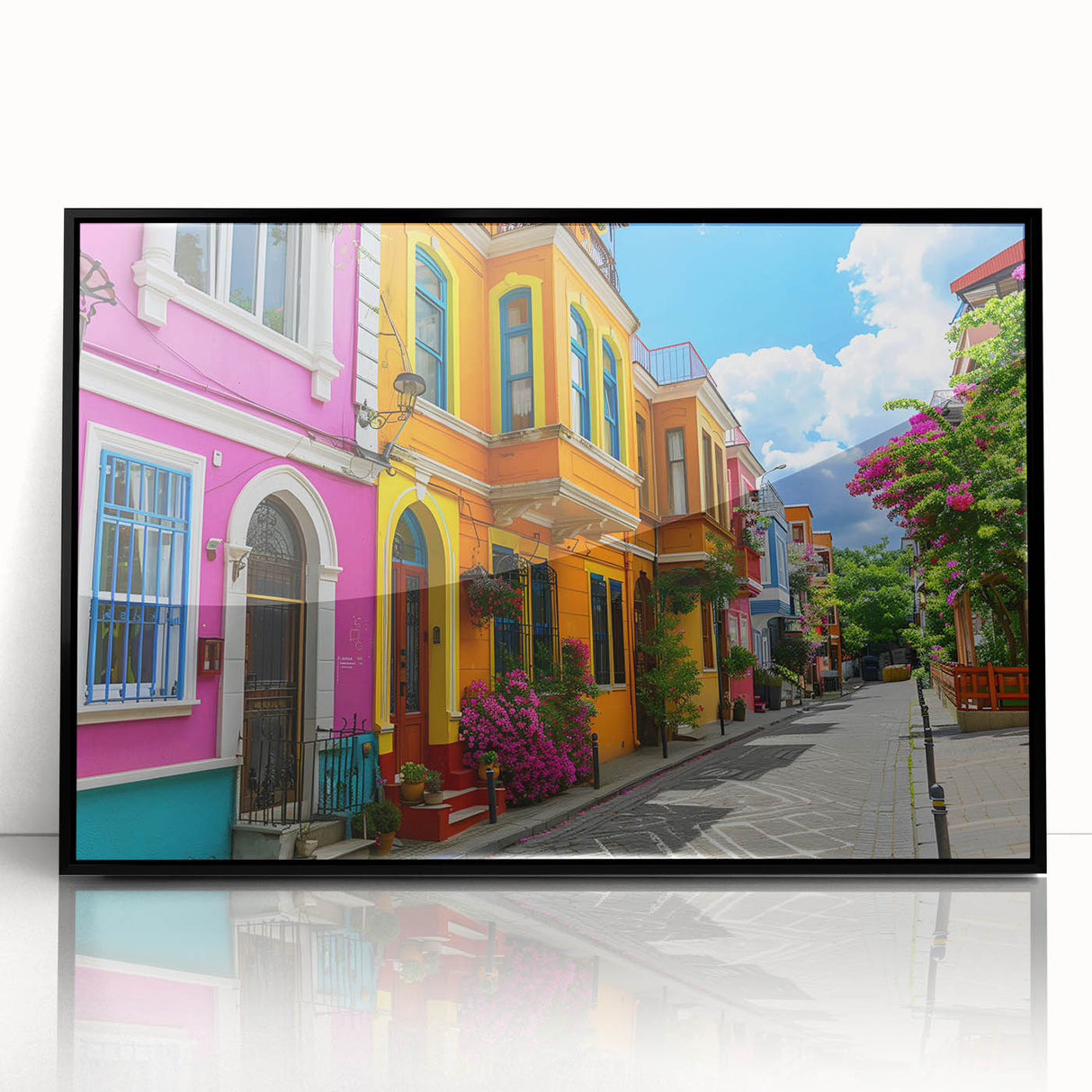 Framed acrylic wall art depicting a vibrant urban landscape with streets and buildings, featuring a modern design in a sleek black frame, ideal for home decor.