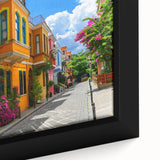 Close-up of a framed canvas wall art piece showcasing a vibrant street landscape design, featuring rich colors and intricate details, perfect for modern home decor.