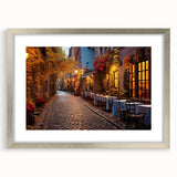 Framed silver wall art featuring a colorful city landscape design, ideal for modern home decor. The piece is set within a stylish mat, enhancing its visual appeal.