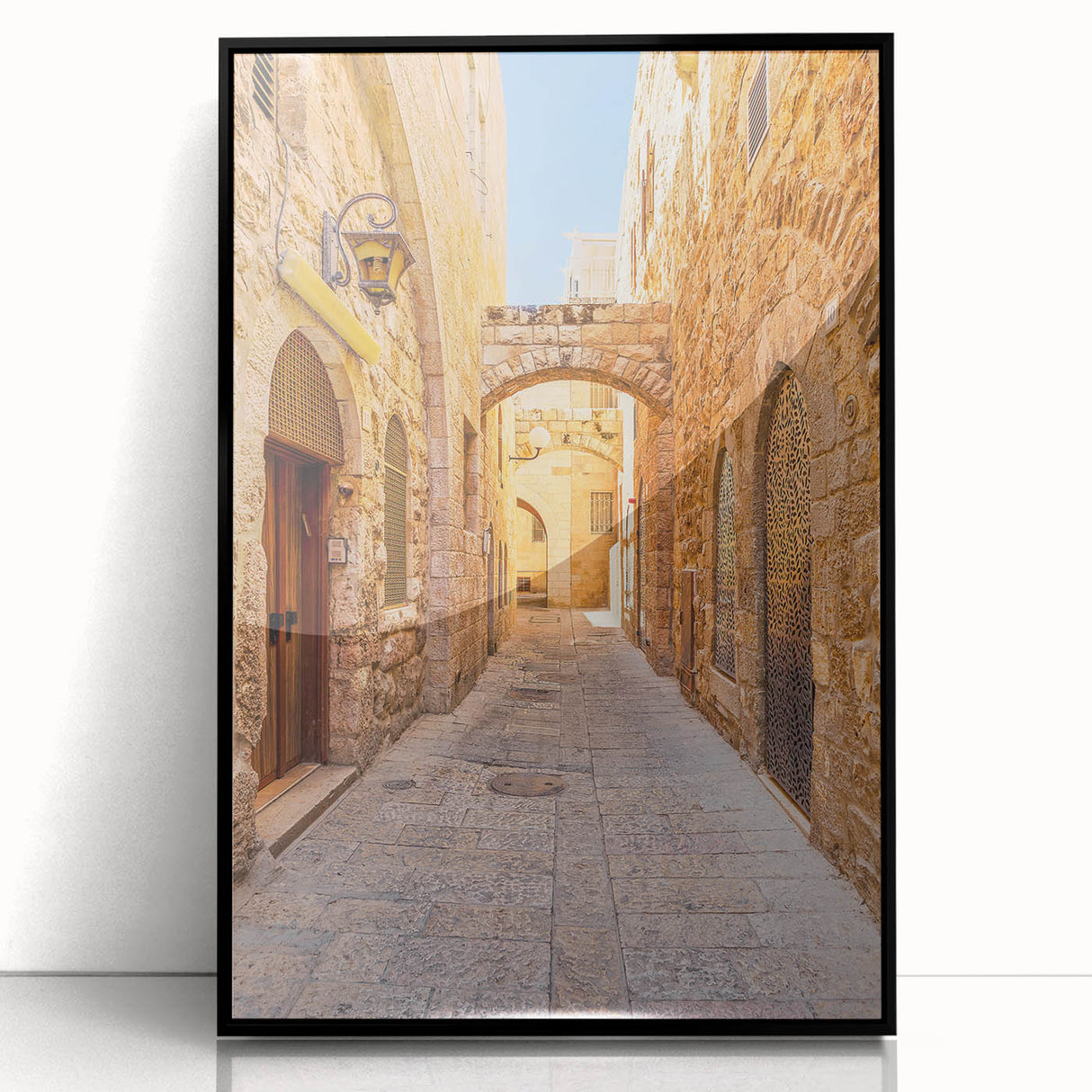 Framed acrylic wall art showcasing a contemporary street landscape design in vibrant colors, featuring a sleek black frame, perfect for modern home decor.