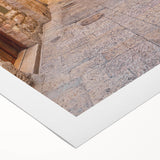 Rolled canvas artwork displaying a vibrant urban landscape design, featuring detailed street scenes and colorful buildings, ideal for modern home decor.