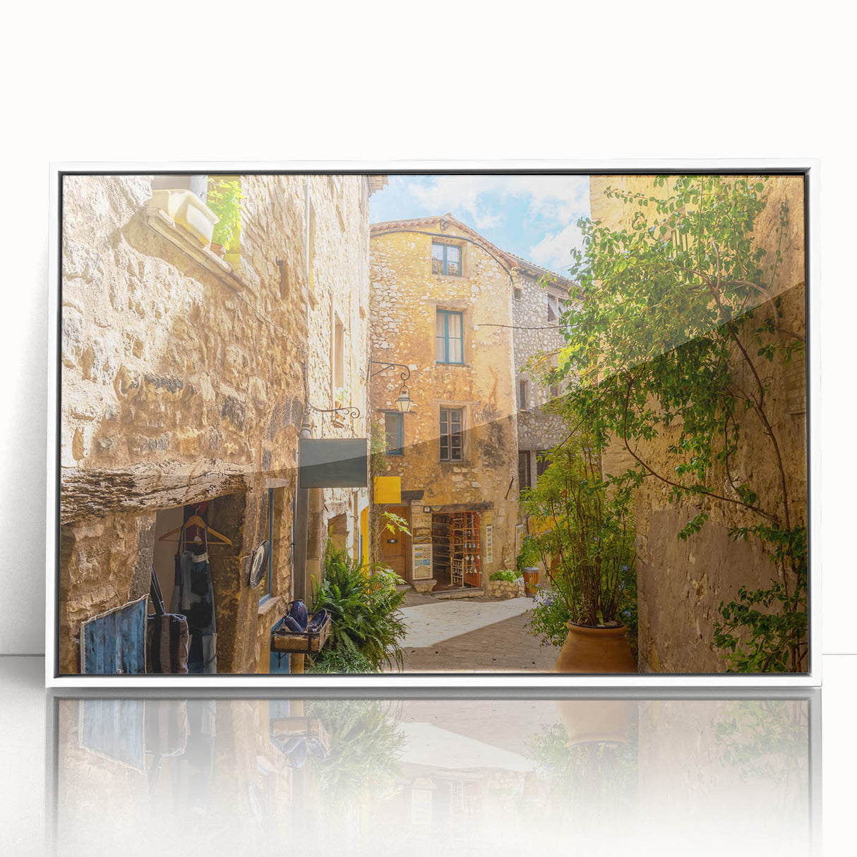Framed acrylic wall art featuring a vibrant landscape design with colorful streets, displayed in a sleek white frame, perfect for modern home decor.