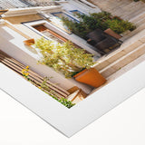 Vibrant rolled canvas artwork showcasing an abstract cityscape design with rich colors and dynamic shapes, ideal for modern home decor and artistic expression.