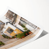 Rolled canvas print showcasing a vibrant cityscape design featuring colorful streets and detailed architectural elements, ideal for modern home decor.