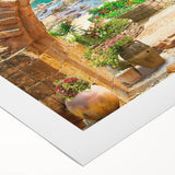 Rolled canvas artwork showcasing vibrant abstract landscape design with bold colors, perfect for modern home decor. Packaged securely in a cardboard tube for safe delivery.