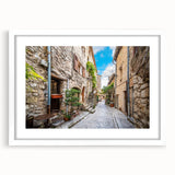 Framed wall art showcasing a vibrant landscape street design, featuring a white mat and sleek frame, perfect for enhancing modern home decor.