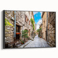 Framed canvas wall art featuring a modern street landscape design with vibrant colors, presented in a sleek black frame, ideal for contemporary home decor.