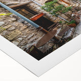 Rolled canvas showcasing a vibrant street landscape design, featuring colorful buildings and urban elements, ideal for modern home decor. Packaged securely for delivery.