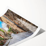 Rolled print of a vibrant landscape street design wall art, showcasing colorful urban scenery with intricate details, packaged securely in a protective tube.