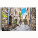Stretched canvas wall art showcasing a vibrant urban landscape design, featuring colorful streets and buildings, perfect for modern home decor. This piece enhances interior spaces with its lively aesthetic and artistic flair.