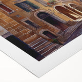 Rolled canvas artwork showcasing a vibrant street landscape design, featuring dynamic colors and intricate details, ideal for modern home decor or office spaces.