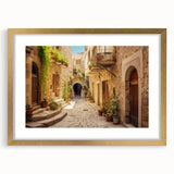 Framed landscape wall art design featuring vibrant street scenes in gold, perfect for home decor. The artwork is displayed with a white mat and a gold frame, enhancing its elegance. Ideal for modern interior styling.