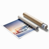 Elegant rolled print showcasing a serene landscape with vibrant green trees and soft blue skies, ideal for home decor or office ambiance, presented in a protective tube.