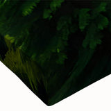 Close-up of a stretched canvas wall art piece depicting vibrant green trees and serene landscapes, showcasing intricate details and textures ideal for home decor.