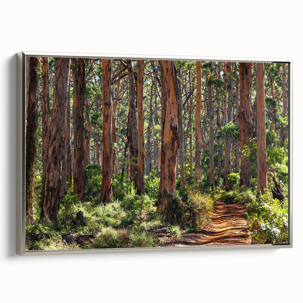 Framed wall art showcasing a serene landscape design with lush green trees, set against a silver frame, adding elegance to modern home decor. Ideal for nature lovers.