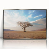 Framed wall art showcasing a serene landscape with vibrant trees, designed in a modern style and featuring a sleek silver frame, perfect for home decor.