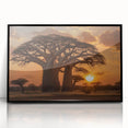 Framed wall art featuring a serene landscape design with trees, presented in a sleek black frame, ideal for adding elegance to home decor.