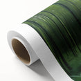 Rolled canvas showcasing a vibrant landscape design with lush green trees and a serene sky, perfect for home decor, presented in a protective cardboard tube.