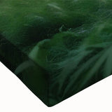 Close-up of a stretched canvas wall art featuring a vibrant landscape design with lush green trees and a serene sky, perfect for enhancing home decor.