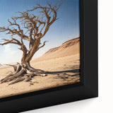 Close-up of a framed canvas wall art piece featuring a vibrant landscape with trees, showcasing intricate details and rich colors, perfect for home decor.