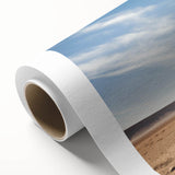 Rolled canvas showcasing a vibrant landscape design with lush green trees and a serene blue sky, ideal for enhancing home decor and creating a tranquil atmosphere.