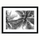 Modern black-framed wall art featuring a serene landscape design with trees, set against a clean white mat, ideal for contemporary home decor.