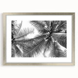 Silver-framed wall art featuring a serene landscape design with trees, displayed with a mat for an elegant presentation, perfect for enhancing home decor.