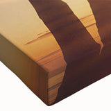 Close-up view of a vibrant stretched canvas wall art piece depicting a serene landscape with lush green trees, perfect for home decor enhancement. The artwork showcases intricate details and natural colors, creating a calming atmosphere suitable for living spaces or offices.