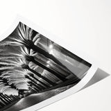 Rolled print showcasing a serene landscape with vibrant green trees and a calming blue sky, ideal for home decor. Packaged securely in a cardboard tube for safe delivery.