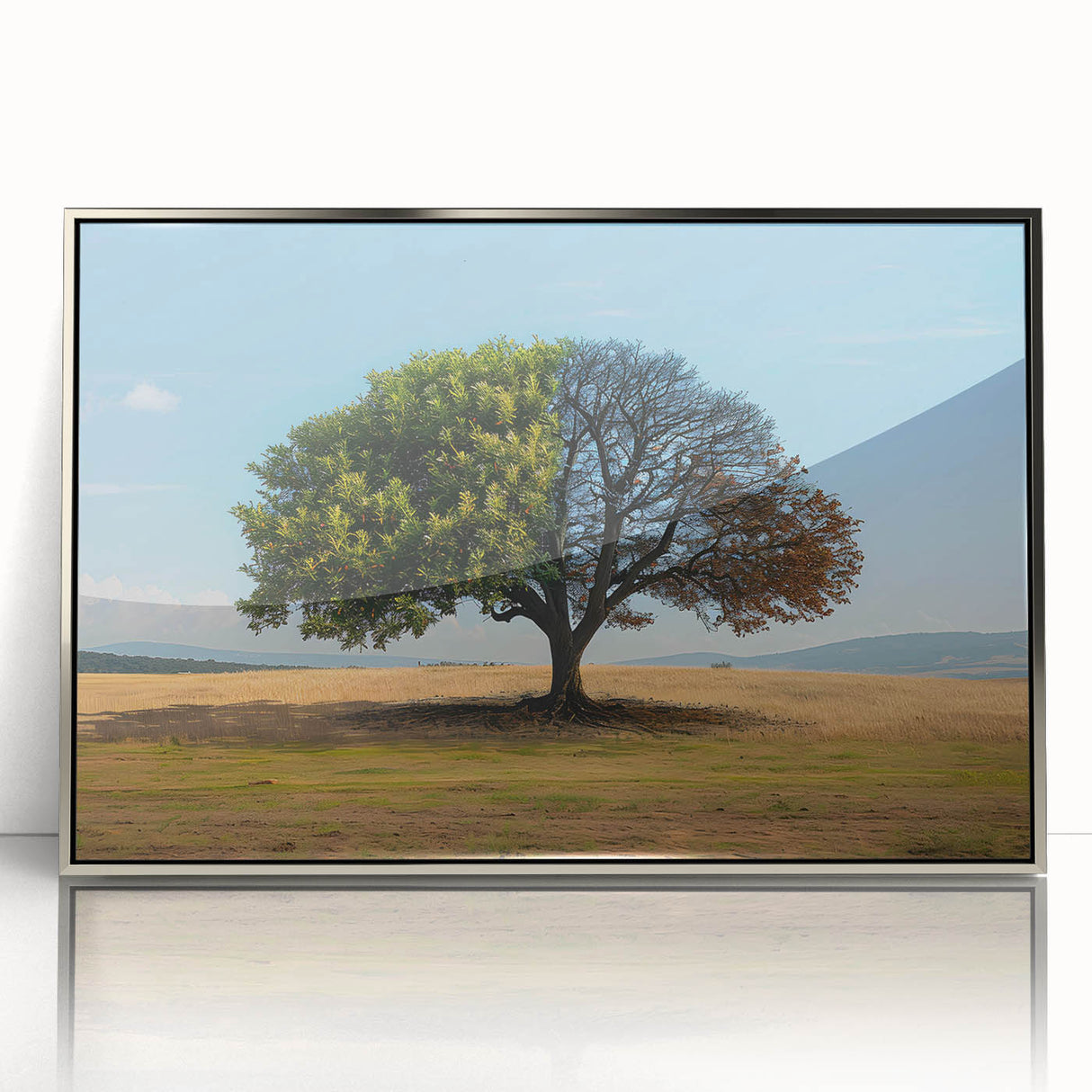 Framed wall art collection featuring a serene landscape with trees, displayed in a silver frame, enhancing modern decor with its elegant design. Perfect for nature lovers.