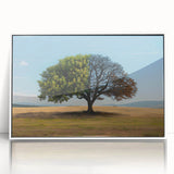 Framed acrylic wall art showcasing a serene landscape with vibrant green trees against a soft blue sky, perfect for home decor enhancement.