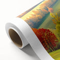 Rolled canvas artwork showcasing a vibrant landscape design with diverse trees and vivid colors, ideal for home decor, elegantly packaged in a protective cardboard tube.