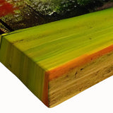 Close-up of a stretched canvas wall art piece showcasing a vibrant landscape with lush green trees and a serene blue sky, perfect for home decor.