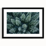 Framed black wall art featuring a serene landscape design with trees, elegantly matted for a polished look, ideal for enhancing modern home decor.